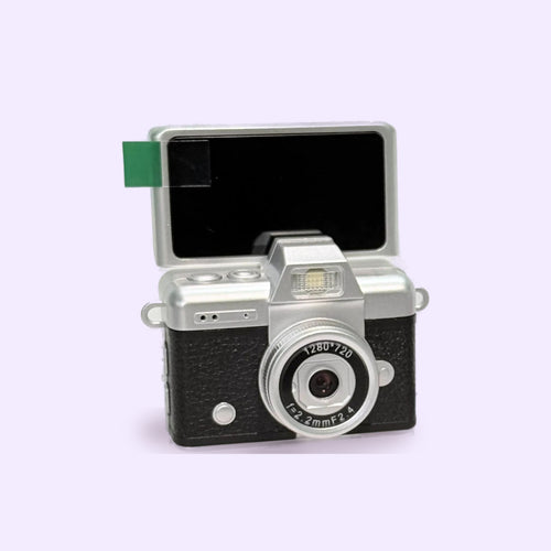 Snapcharm Flip Digicam in black and silver with the screen flipped up – real photo